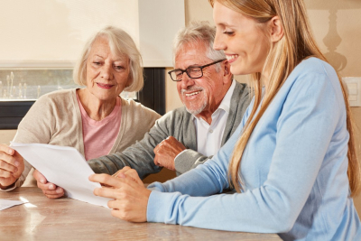 adult woman having a financial planning with senior couple